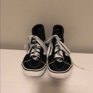 Black and white high top vans